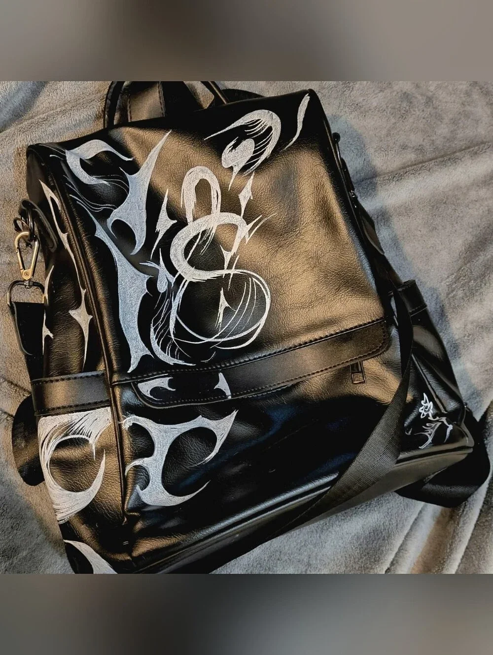 Black Men's Leather Shoulder Bag with White Graphic Accents